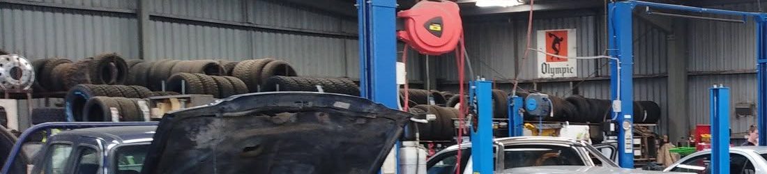 Truck, 4WD and tractor tyres racked up in the workshop